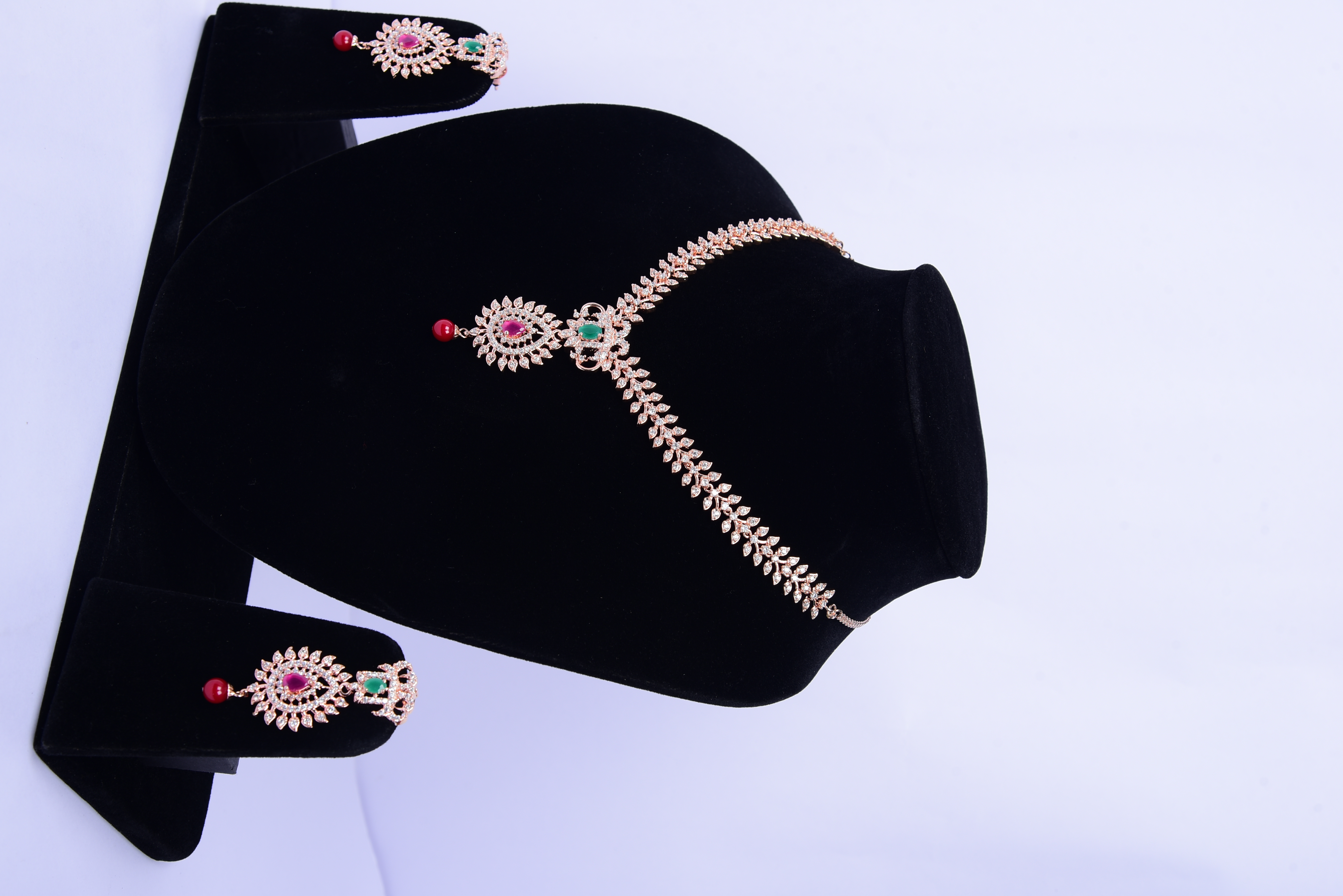 Namokriti Elegant Rose Gold Necklace Set with Ruby & Emerald Accents – Perfect for Weddings & Festive Glam